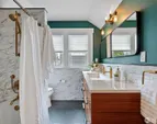 Tastefully renovated bath on upper level.