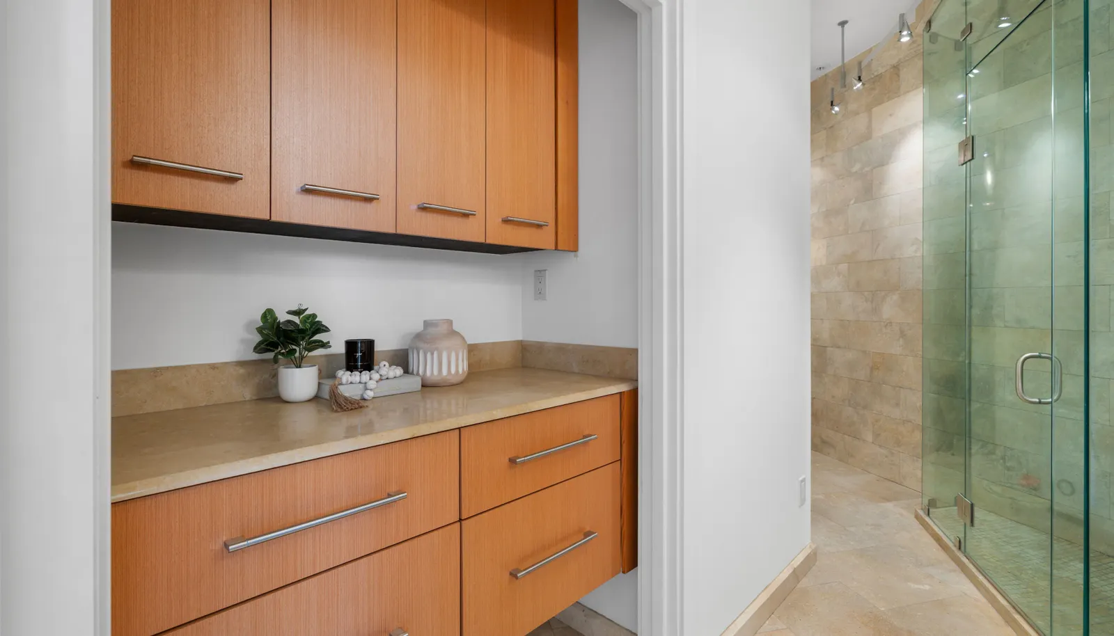 The secondary bathroom offers Steamist steam shower with built in shelving.