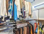 Custom Elfa closet system in the primary suite thoughtfully designed for organization and efficiency.