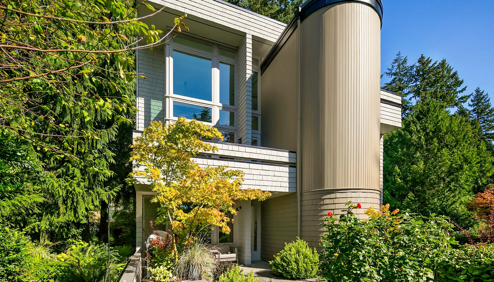 The home is surrounded by lush gardens and enjoys a sunny SW exposure, with two upper balconies and a large patio. The home is surrounded by lush gardens and enjoys a sunny SW exposure, with two upper balconies and a large patio.