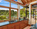 The sink overlooking the back yard and waterfront