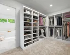 Virtually staged walkin closet.