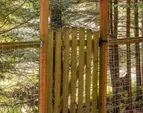 Private garden gate at the rear of the property with potential connection to the surrounding greenbelt.