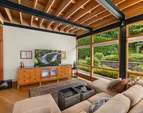 The architectural design of the curved interior wall of the den is also carried to the outer design. The spaces are seamlessly integrated.