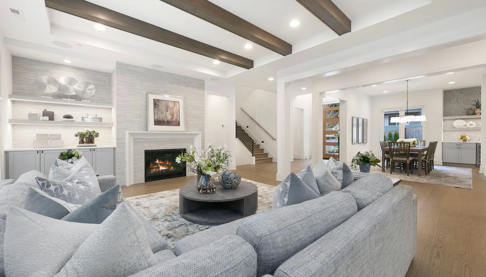 Fireplace w/ Porcelain Tile Surround and Custom Display Built-Ins w/ Under Shelving Lighting.