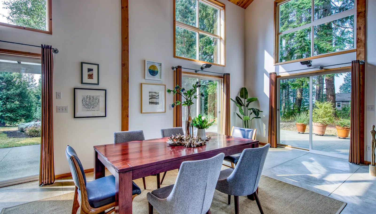 Interior dining area open to the patio and outdoor living and dining areas.