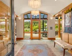 Upon entry the eye is drawn through the walls of glass to the waterside of the home, integrating indoor and outdoor spaces. 