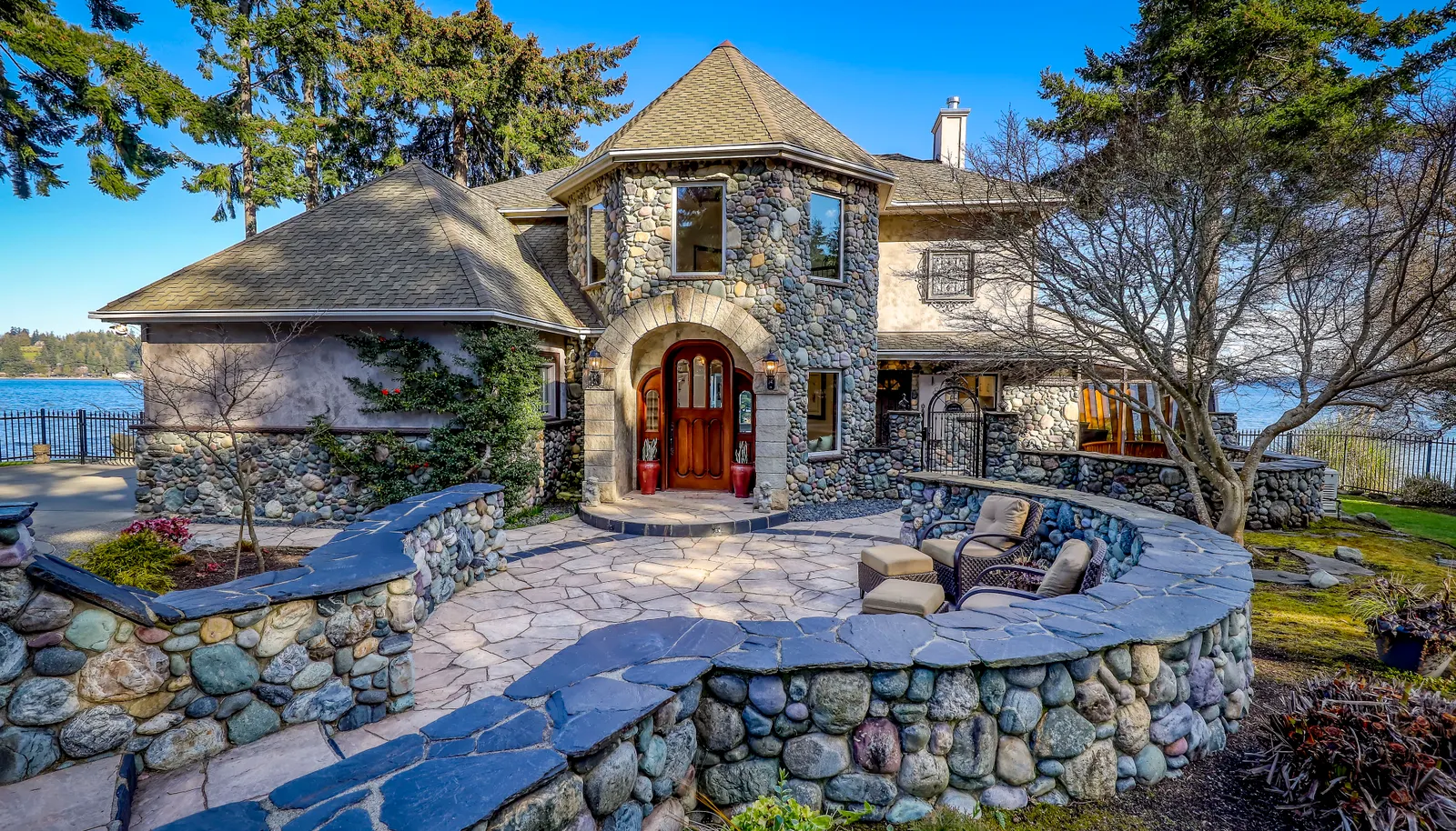 Exquisite real river rock and natural stone walls, patios, pathways, and siding.