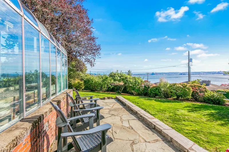 View from side yard to Commencement Bay and breathtaking Mount Rainier (looms large on a clear day)! View from side yard to Commencement Bay and breathtaking Mount Rainier (looms large on a clear day)!