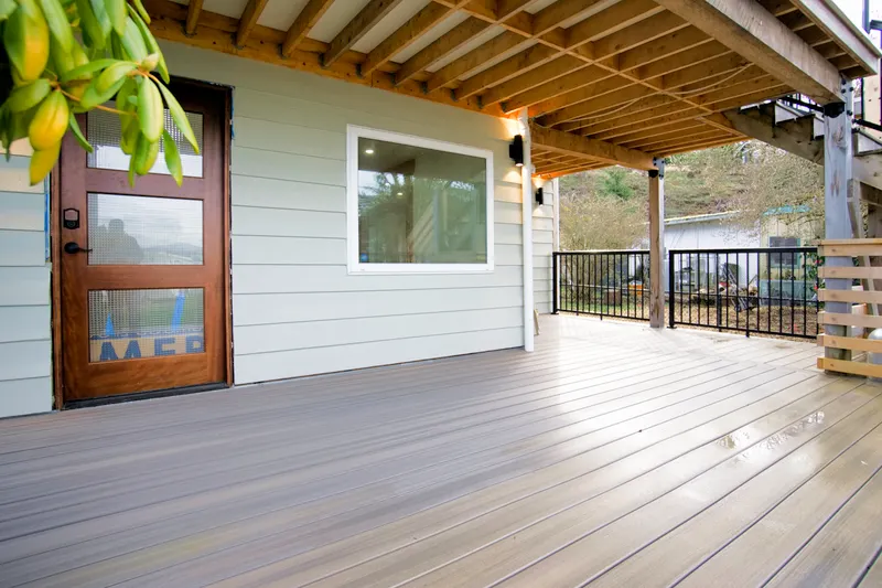 Main level deck and main entrance into the first floor.