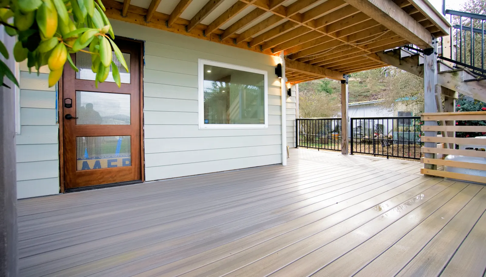 Main level deck and main entrance into the first floor.