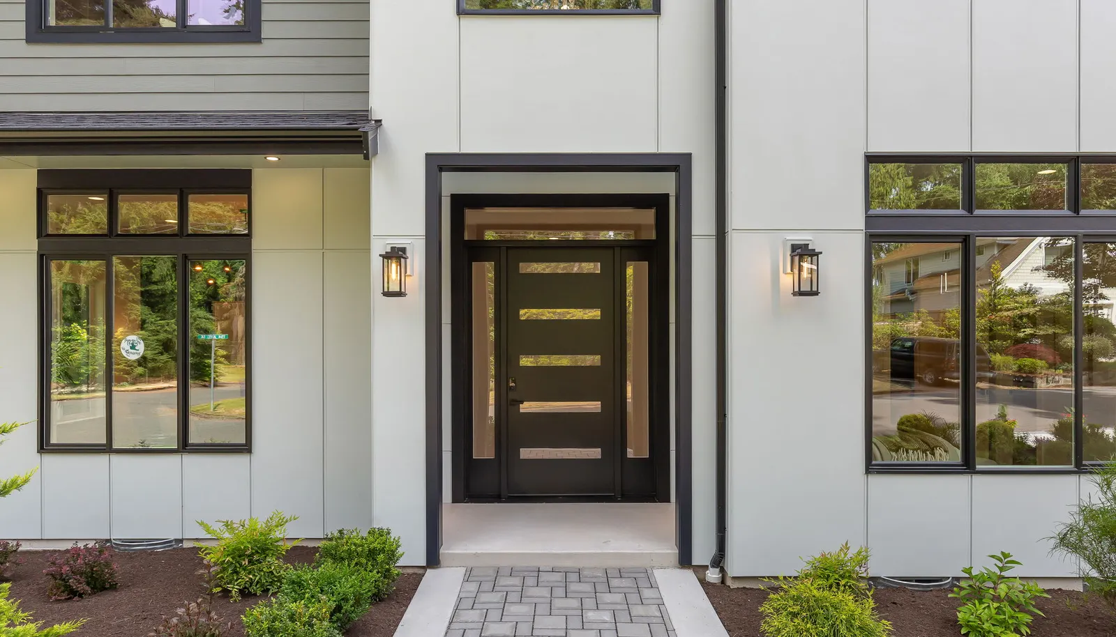 Impressive two-story covered foyer designed for both style and privacy.