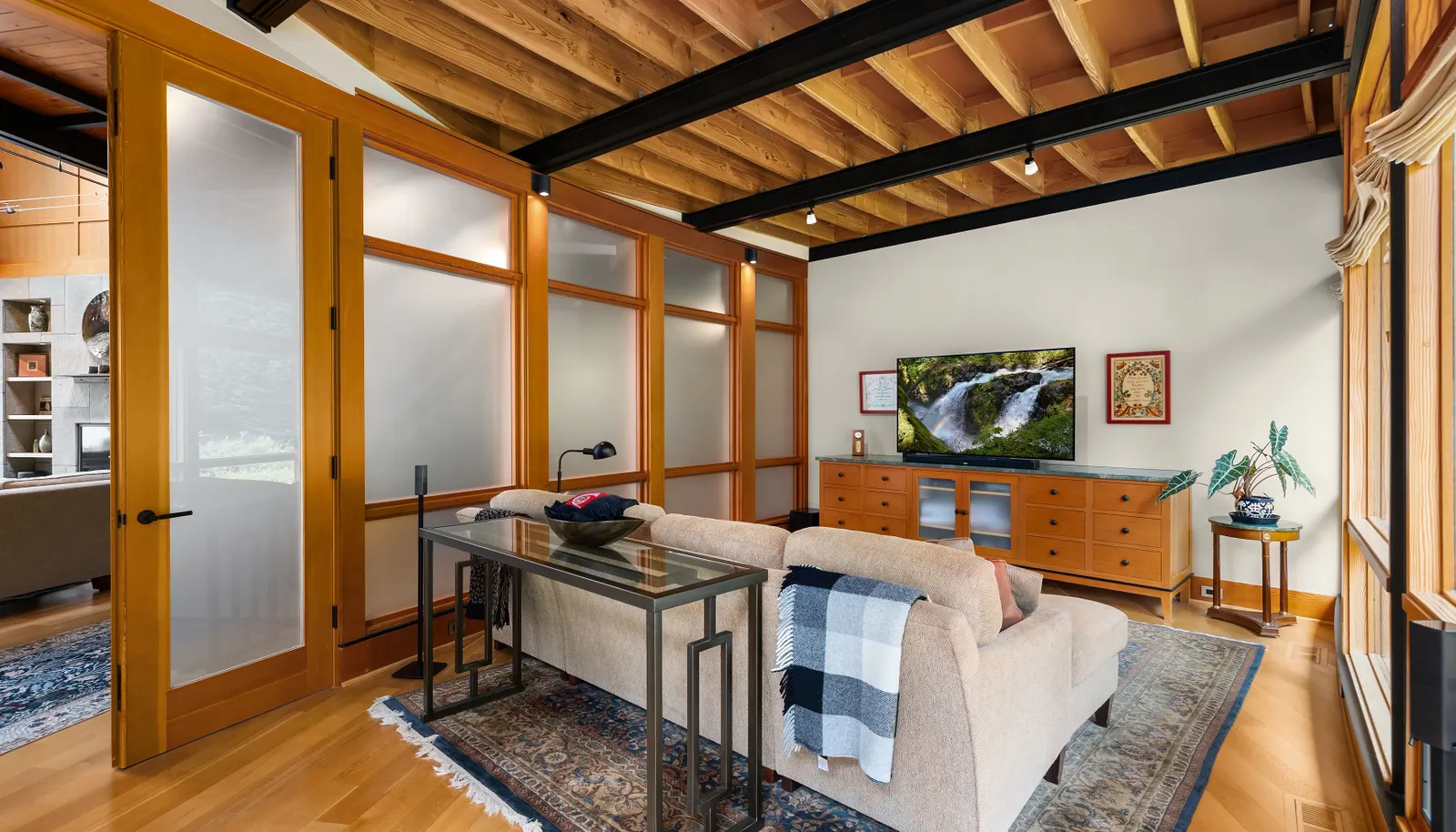 This space is on the garden side of the home and is the perfect den for watching TV, movies and The World Cup!