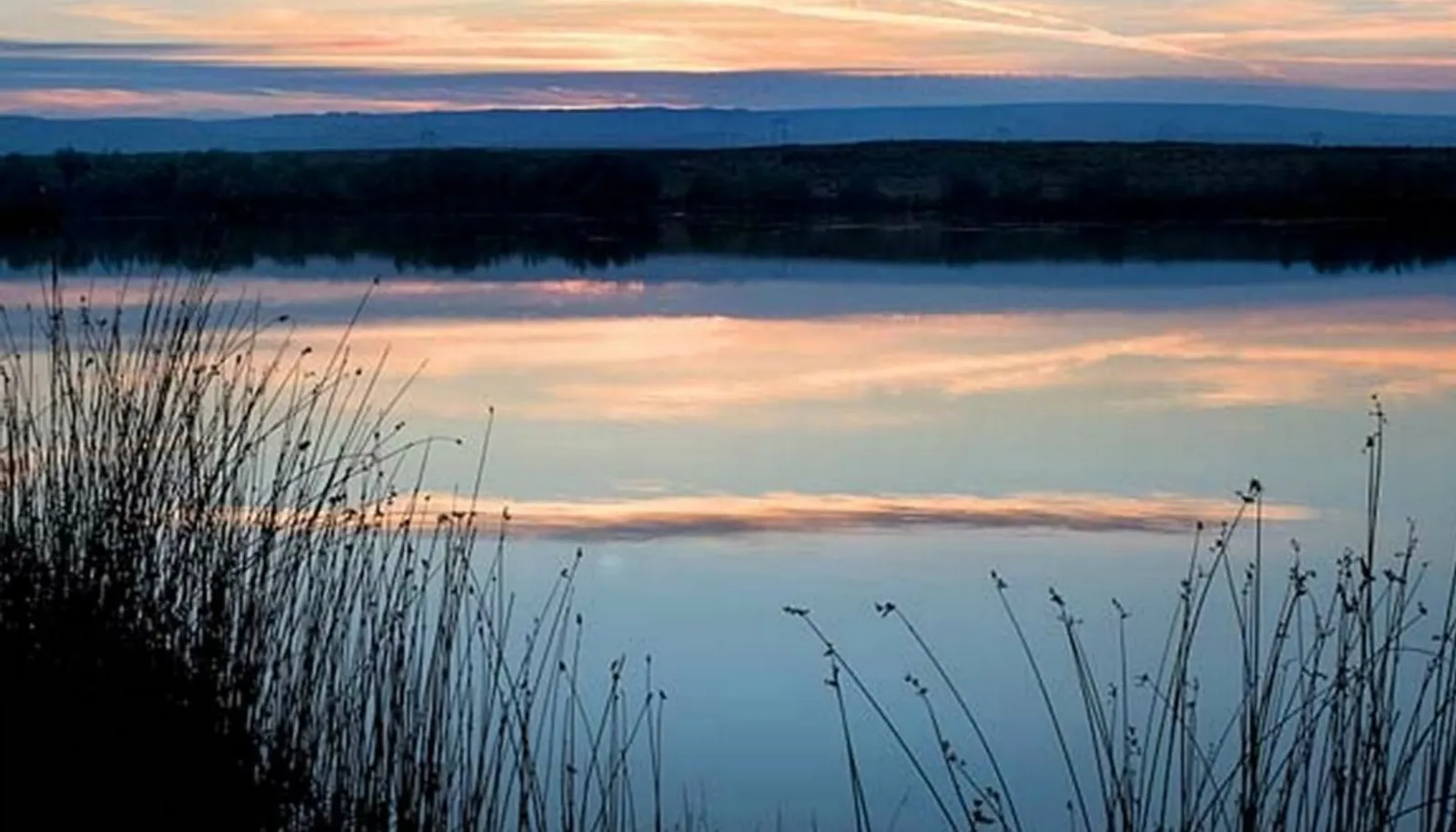 One of three lakes on the property. 60 acres of lakes offering fishing, duck hunting and home site lots with stunning views.