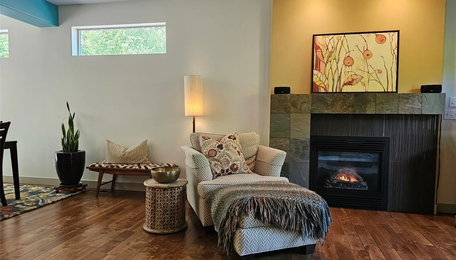 enjoy the custom fireplace while sitting in the spacious living room