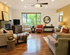 enjoy the custom fireplace while sitting in the spacious living room