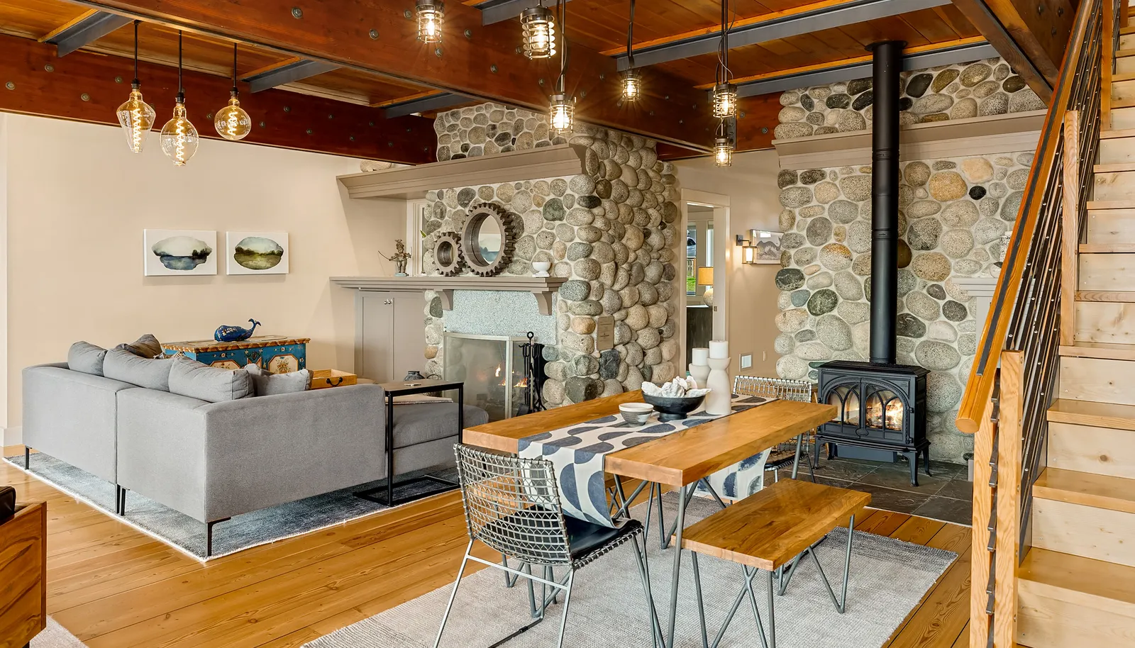 Real river rock, wide plank Fir floors, custom wood and steel materials throughout.