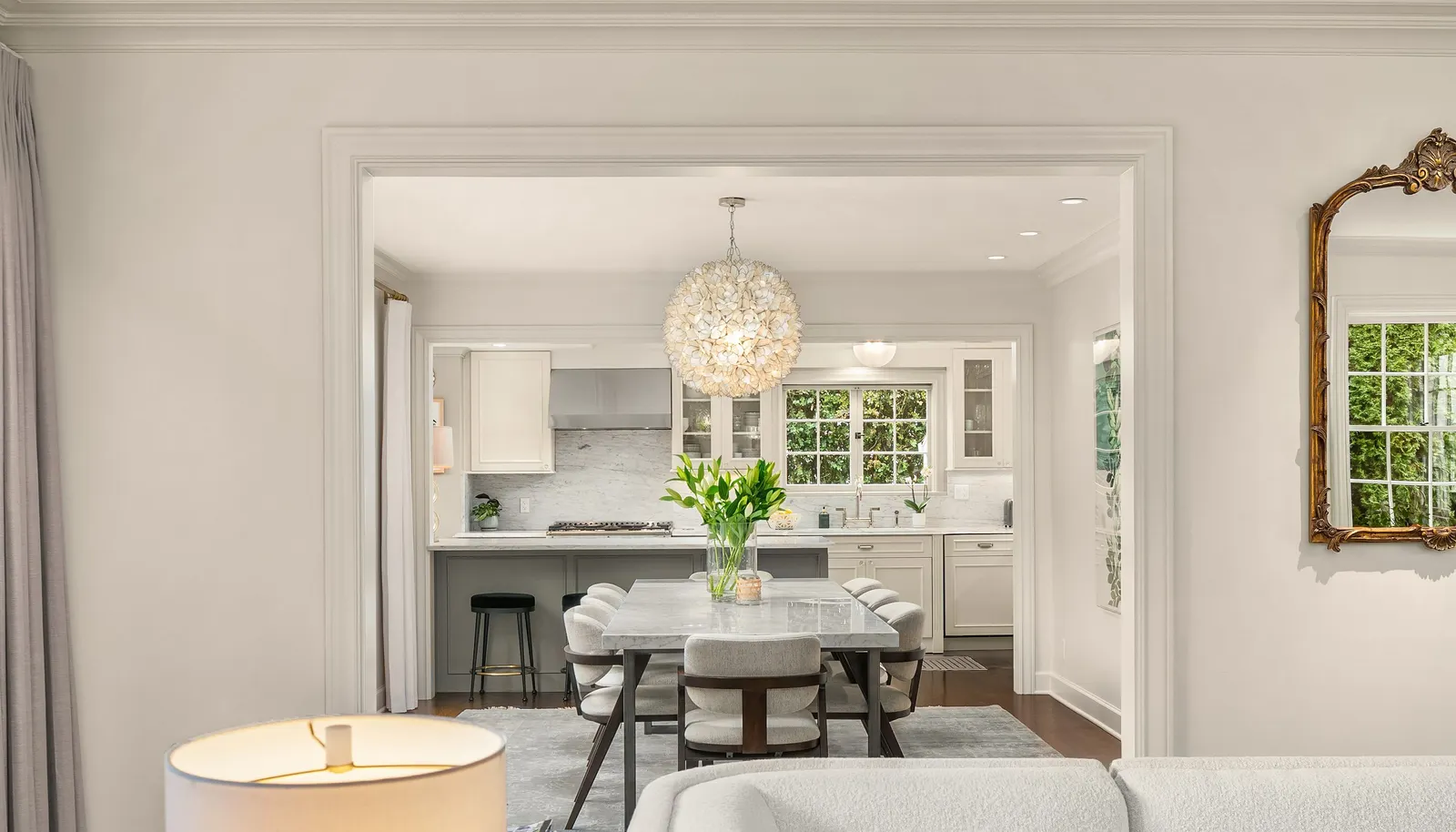Straight on view of the dining room and Kitchen-notice the beautiful light fixture!