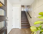 The inviting entry is enhanced with elegant board-and-batten detailing for a refined welcome.