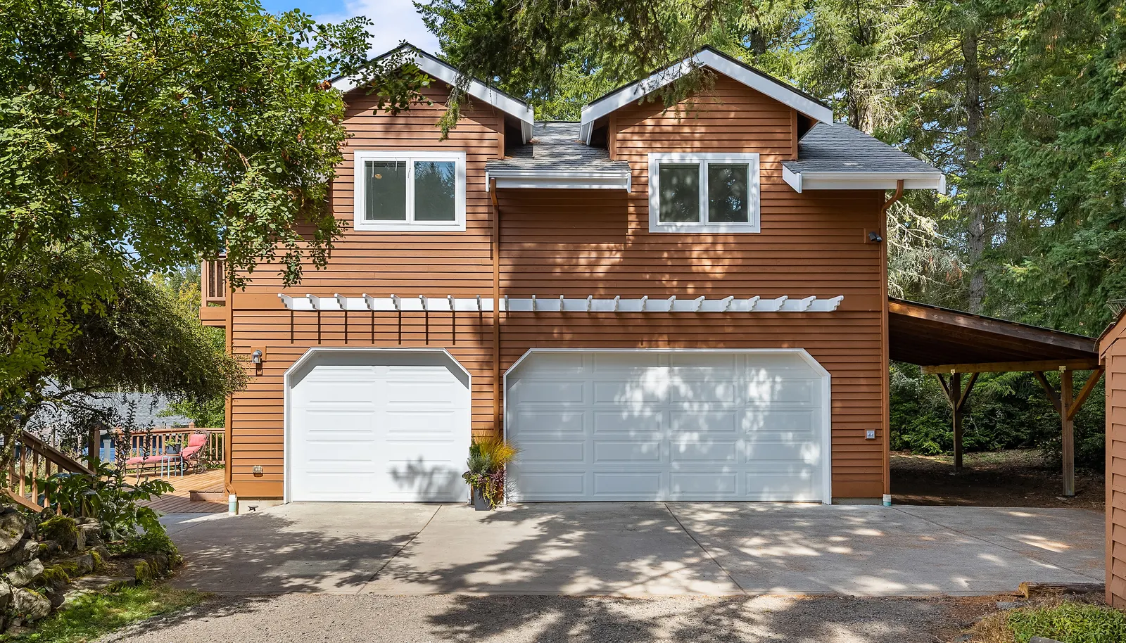 2 Car garage with extra bay for storage/shop and bike storage in 3rd stall.