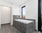 Showroom full bath. Finishes vary by unit. Furniture not included in sale.