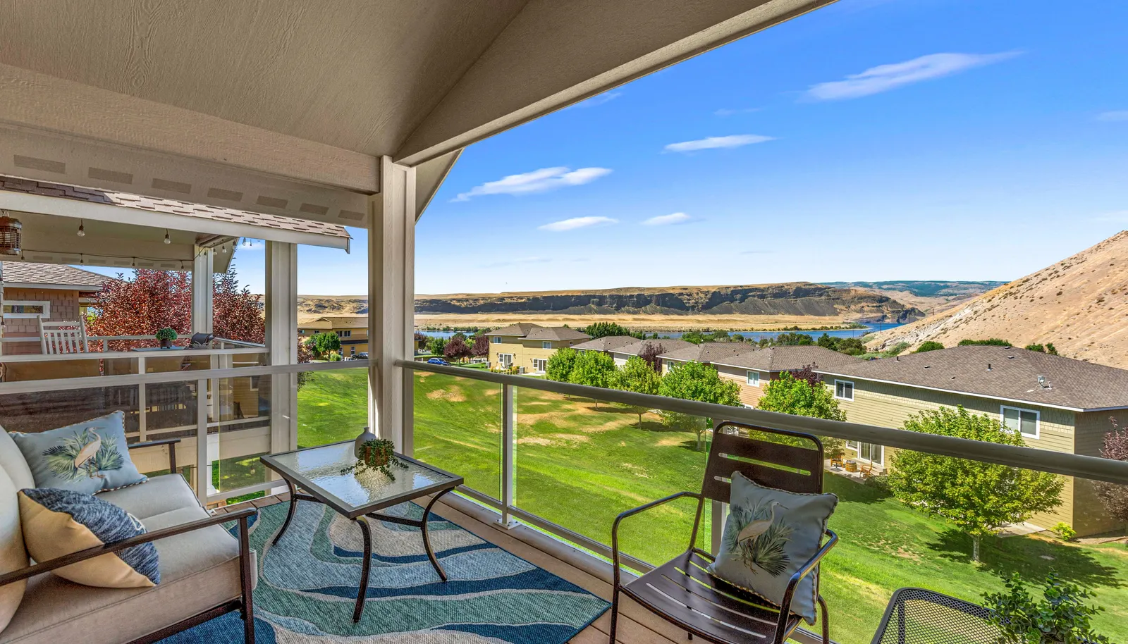 Covered patio with sweeping views - perfect for relaxing or entertaining year round