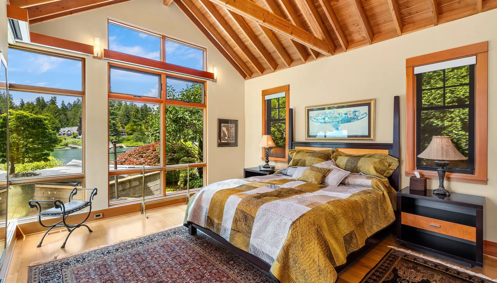 The primary suite with easy access to the hot tub has automatic blinds and gorgeous built-ins