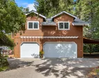 2 Car garage with extra bay for storage/shop and bike storage in 3rd stall.