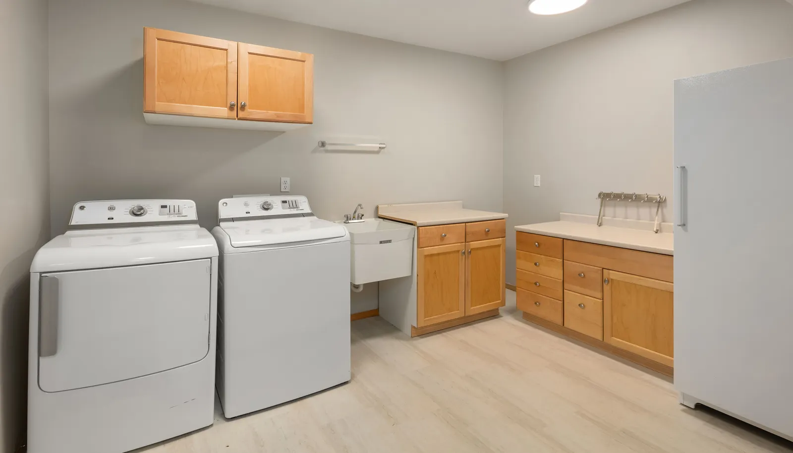 Large utility room has storage space for all your needs.