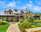 Lush gardens, stunning architecture and expertly executed construction ground the home 