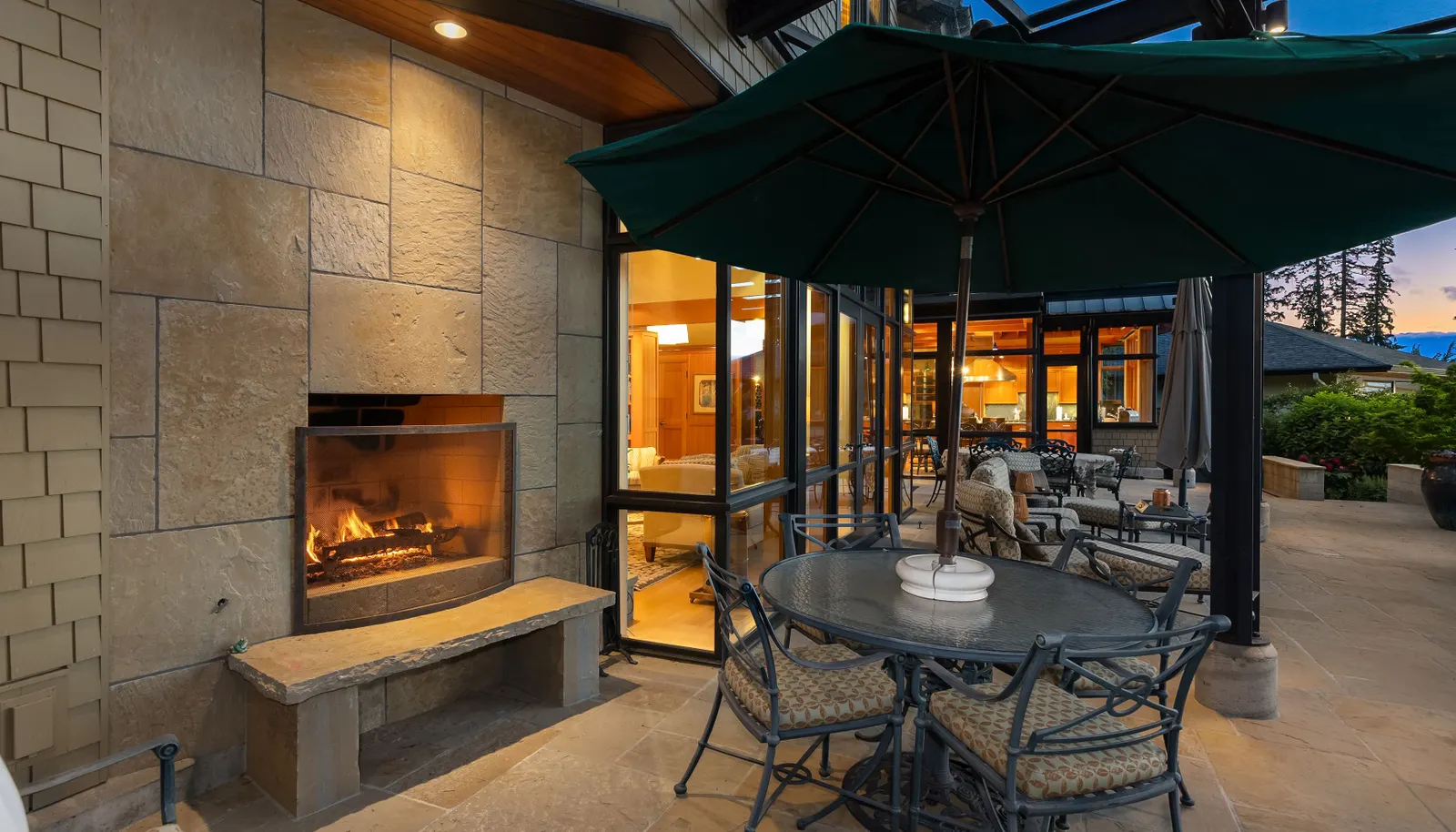 The outdoor wood-burning fireplace on the covered patio