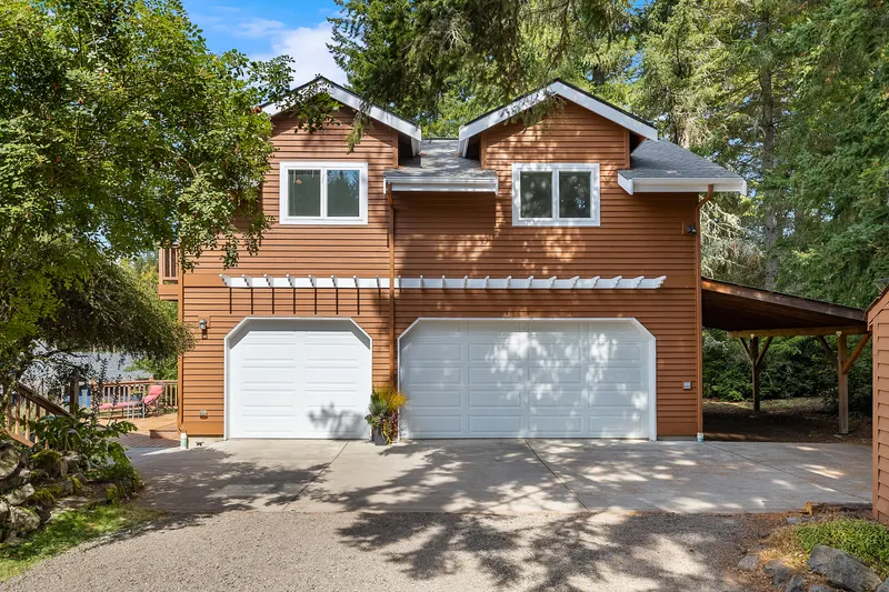 2 Car garage with extra bay for storage/shop and bike storage in 3rd stall.