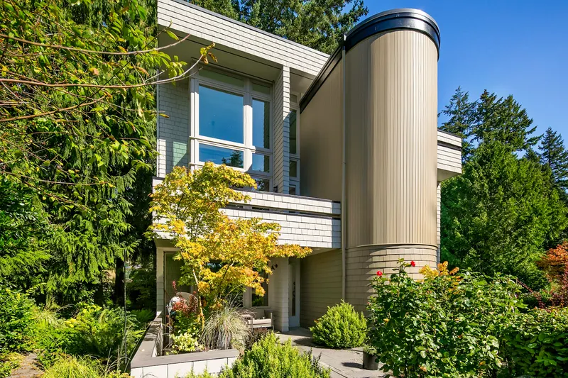 The home is surrounded by lush gardens and enjoys a sunny SW exposure, with two upper balconies and a large patio. The home is surrounded by lush gardens and enjoys a sunny SW exposure, with two upper balconies and a large patio.