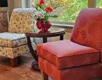 enjoy the custom fireplace while sitting in the spacious living room