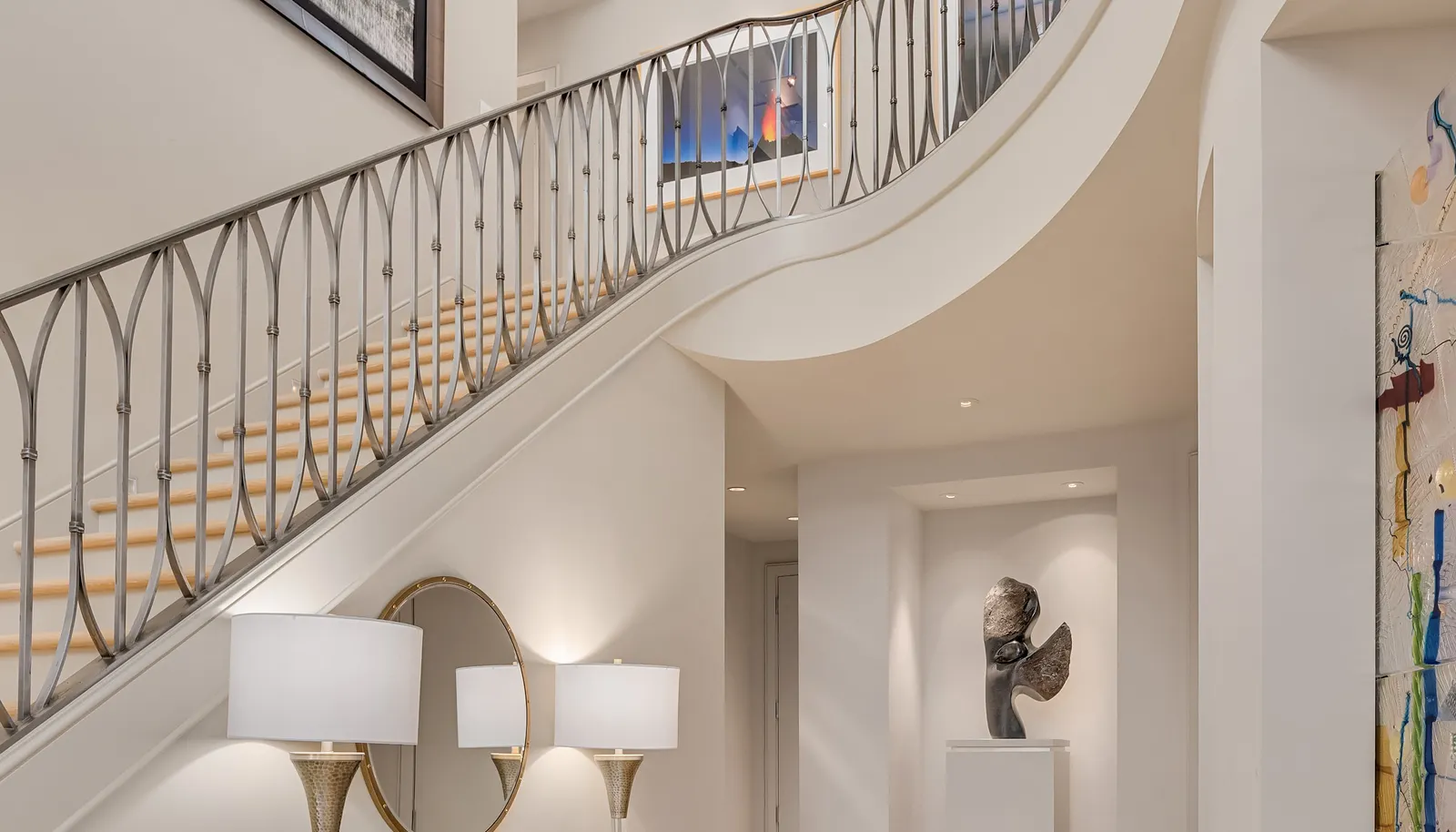 The foyer opens up as you enter the home. The double height (26 feet high at the peak!) entry hall floods the space with light and the custom railing by Matthew Tilton adds the pizzazz! The entire home has silent in-floor radiant heat, and most rooms have a thermostat for temperature control. There are three air handlers for air-conditioning and there is a cooling thermostat on each floor....