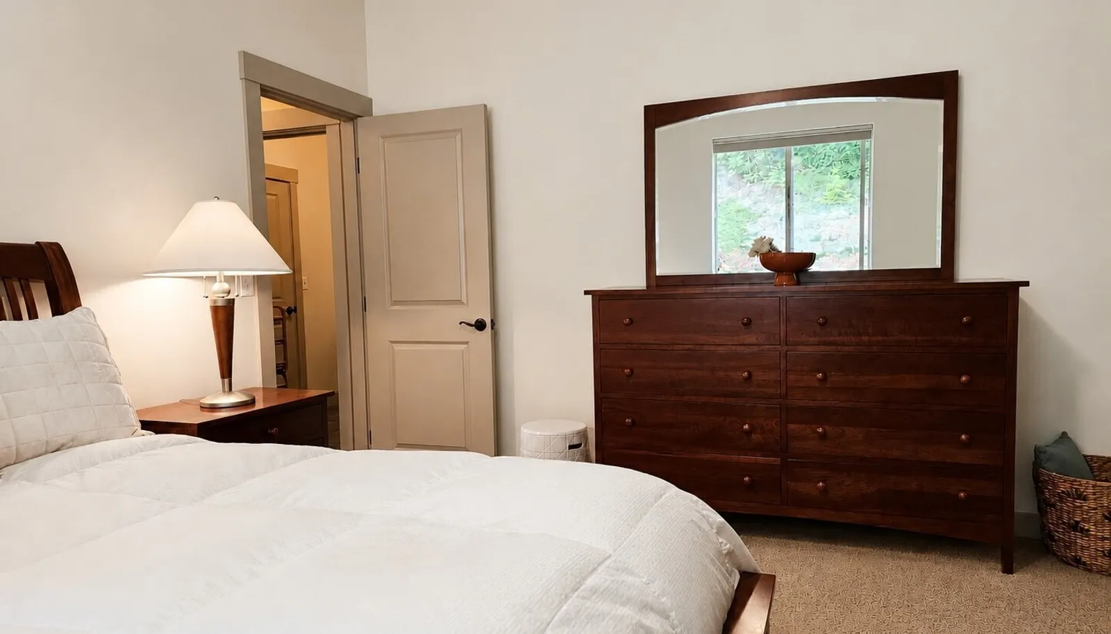 Primary bedroom on main floor, positioned for privacy, overlooking the back garden.