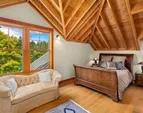 The upper east bedroom has plenty of room for sleeping as well as a sitting area. 