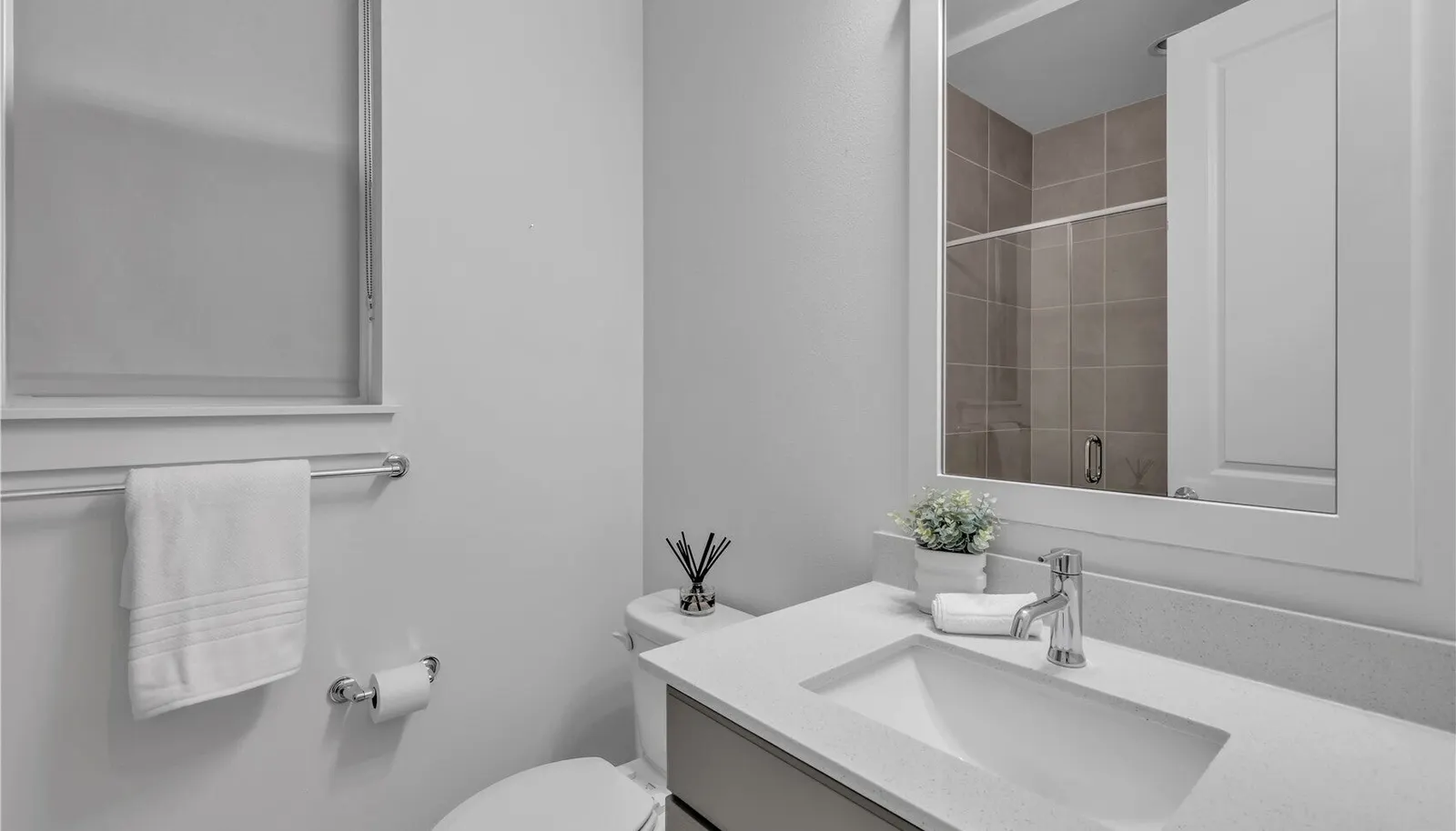Main level three quarter bathroom/powder room.