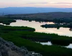 60 acres of lakes and ponds altogether: Hilltop Lake (30 acres) spills over the 400 ft. high basalt cliff into a water fall. Caliche Creek tumbles down alongside the Old Covered Wagon trail into the Coulee.