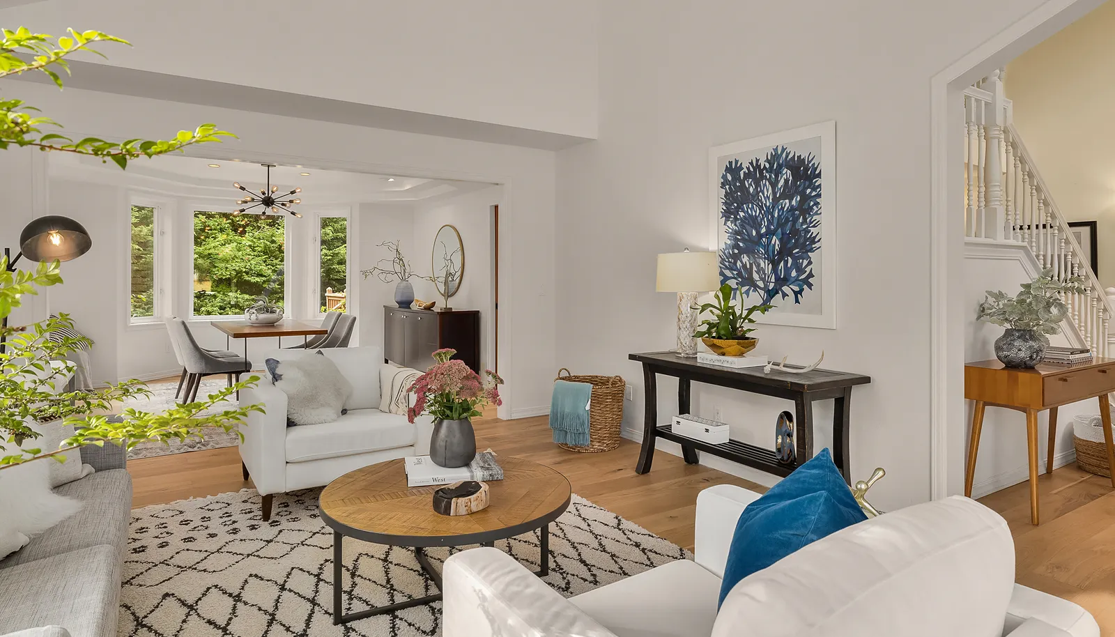 Spacious Living room off entry looking into dining room.
