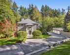 Nestled on a meticulously manicured 41,872 SF lot