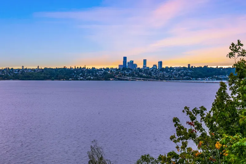 Unobstructed, protected westerly views of the City, Lake, Mountain and sunsets from nearly every square foot of this home.