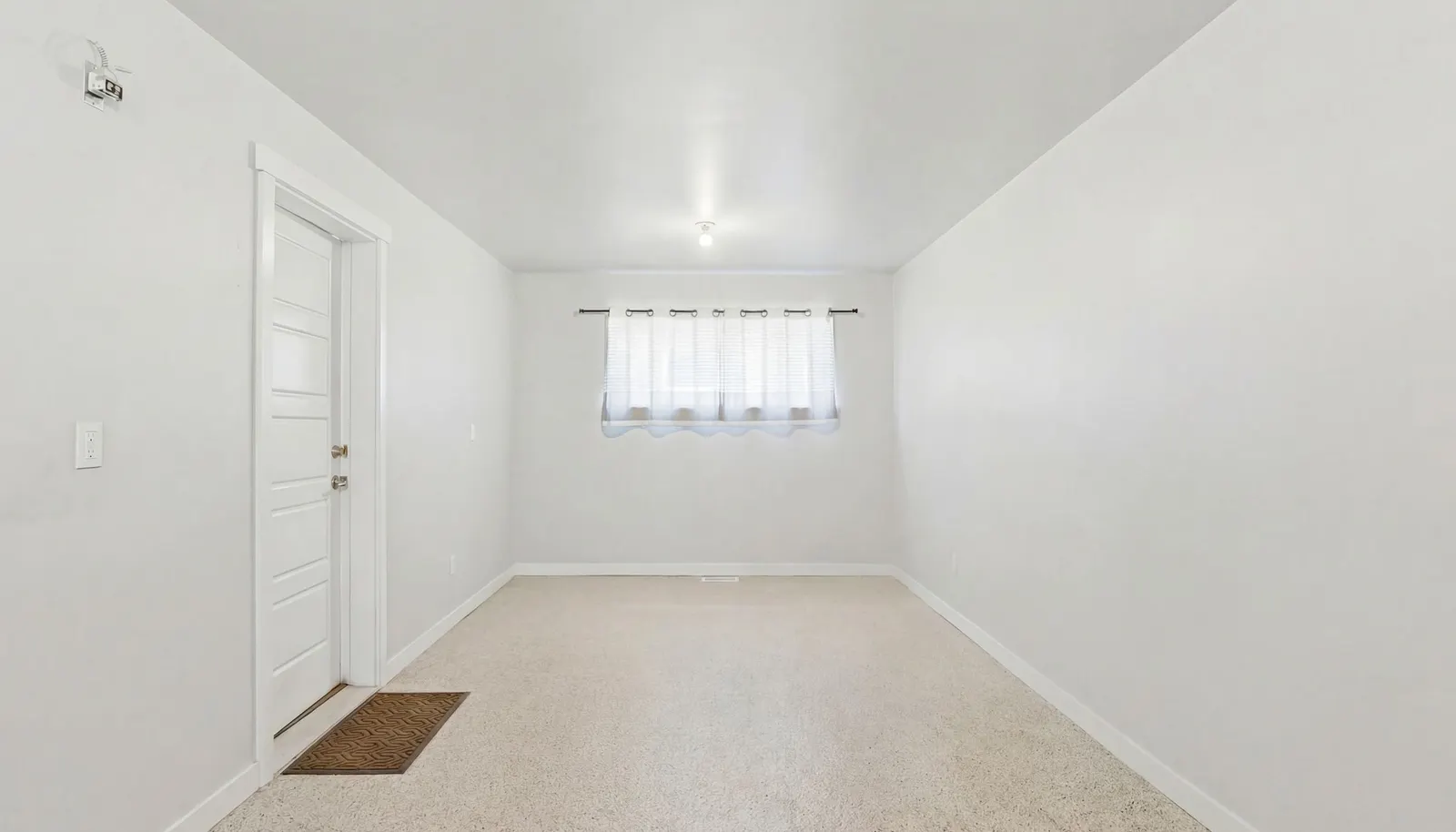 This flexible section of the garage is ideal for a home office, fitness area, studio or workshop.