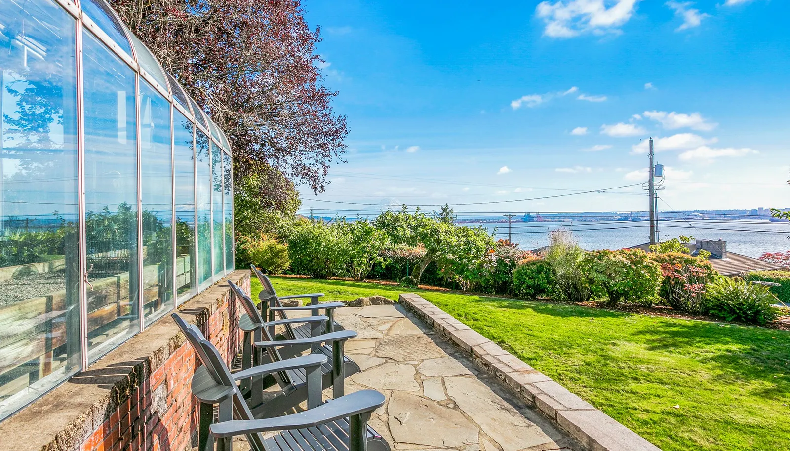 View from side yard to Commencement Bay and breathtaking Mount Rainier (looms large on a clear day)! View from side yard to Commencement Bay and breathtaking Mount Rainier (looms large on a clear day)!