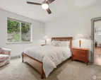 Primary bedroom on main floor, positioned for privacy, overlooking the back garden.
