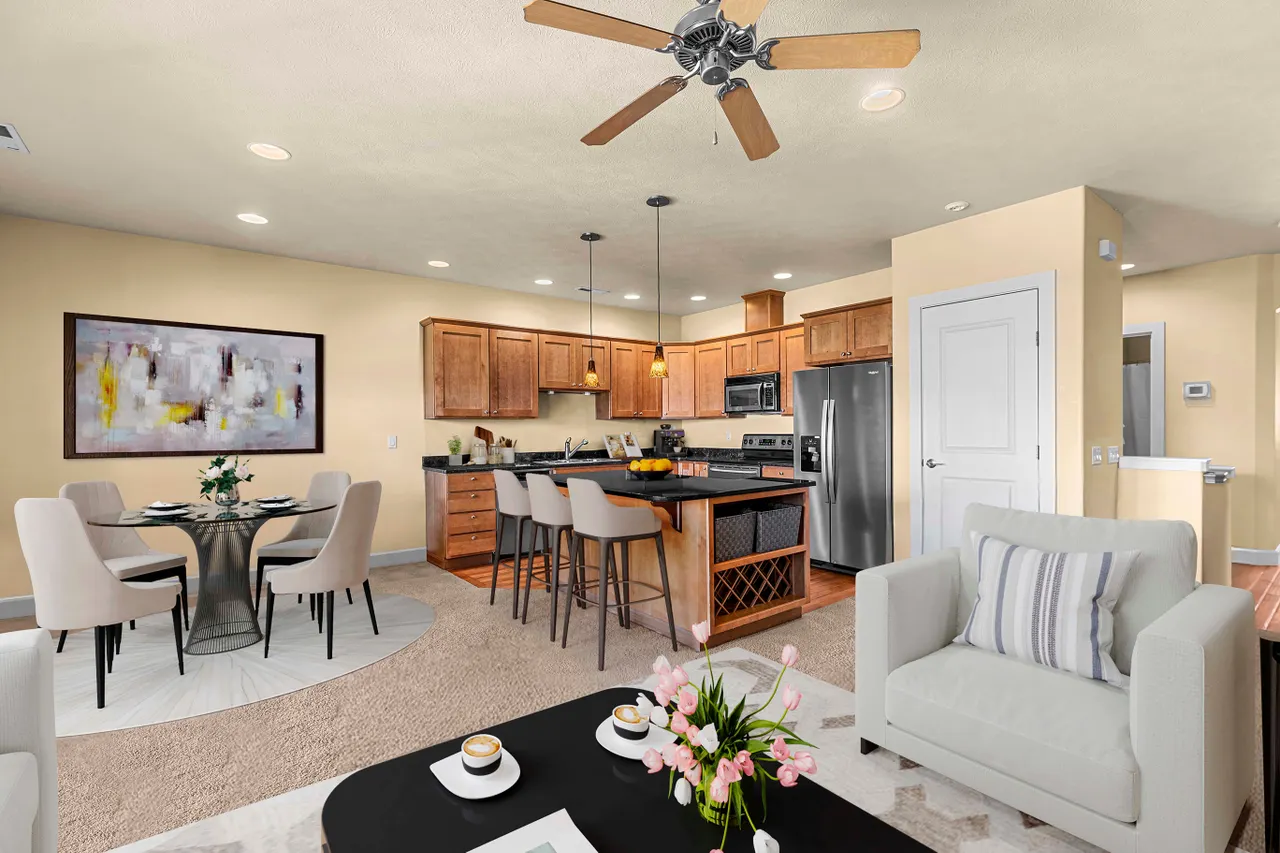 Inviting living area with ceiling fan, modern finishes, and versitile layout