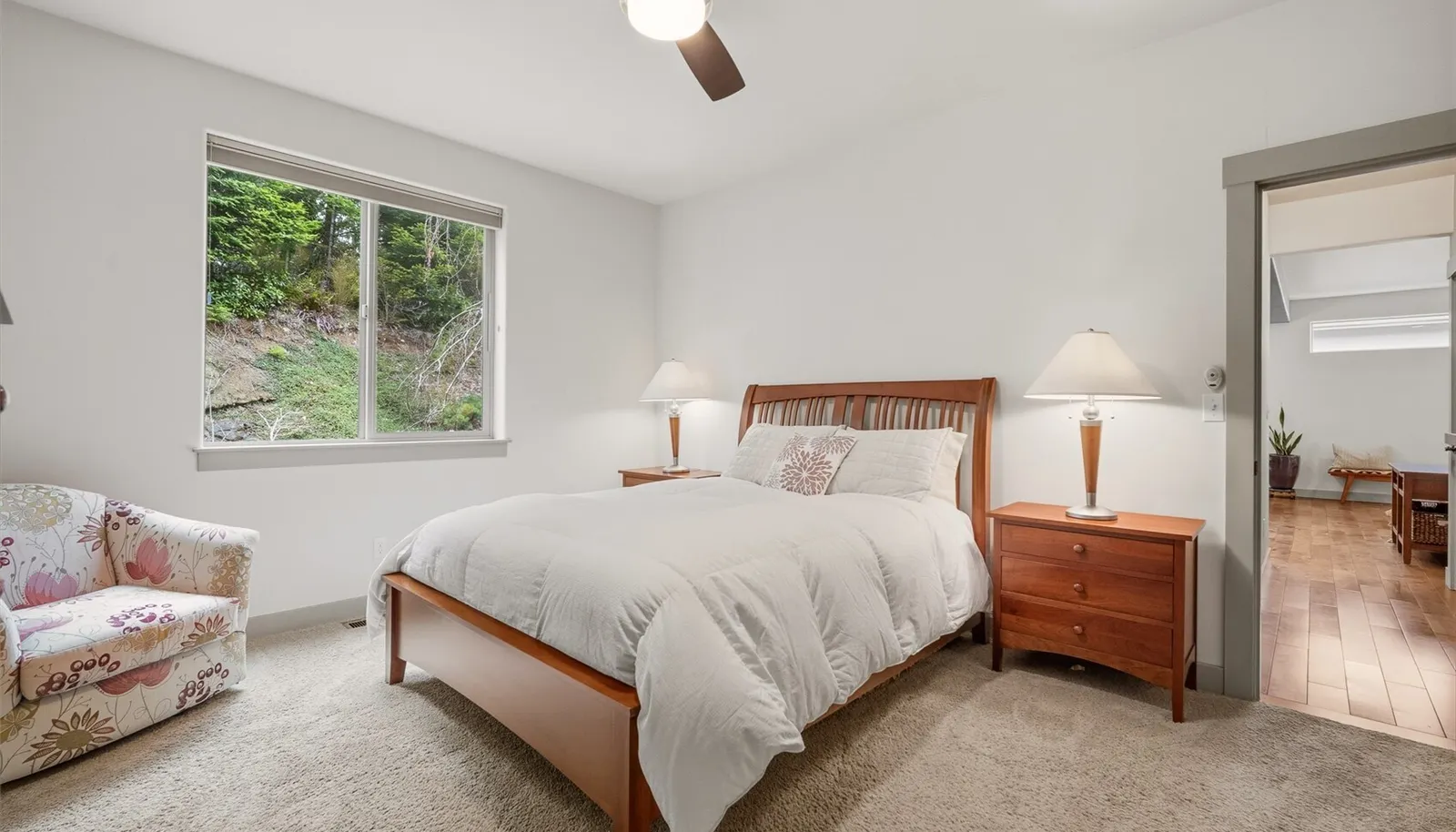 Primary bedroom on main floor, positioned for privacy, overlooking the back garden.