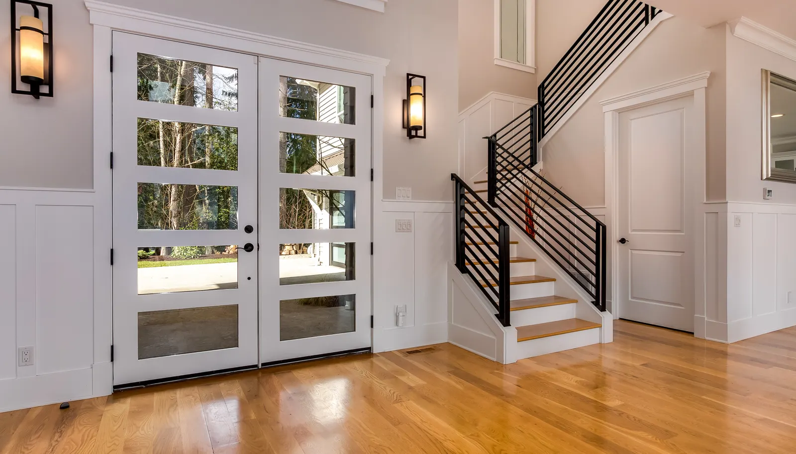 Gleaming oak wide plank wood floors throughout the entire home in all but the three carpeted upstairs rooms.