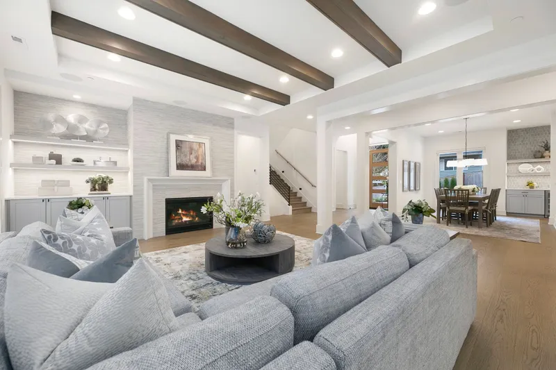 Fireplace w/ Porcelain Tile Surround and Custom Display Built-Ins w/ Under Shelving Lighting.