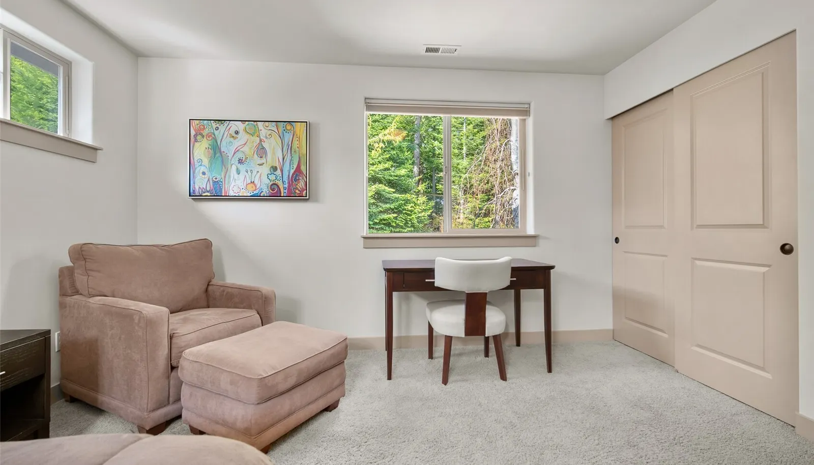 Additional view of bedroom overlooking tranquil garden.
